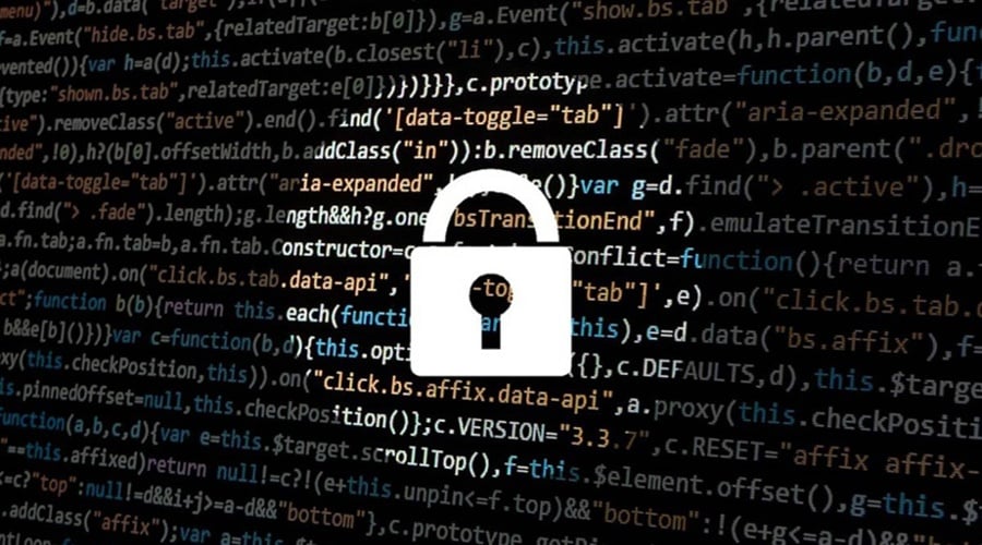 White padlock in a spotlight with lines of code in the background