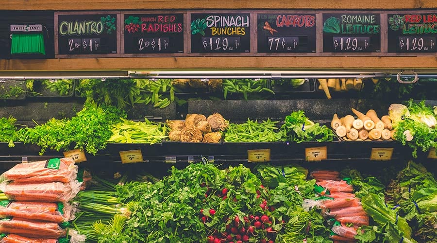 Fresh produce displayed on the stand at a grocery store