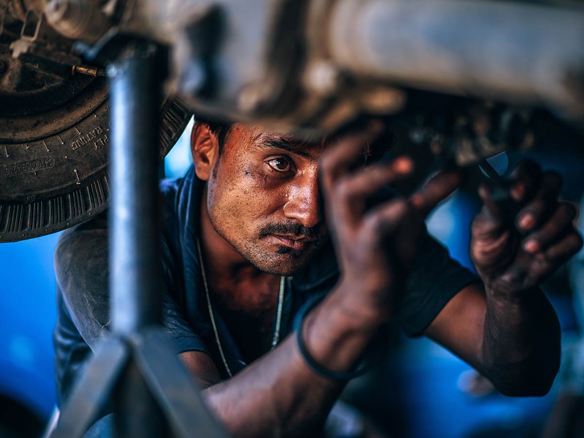 Mechanic doing repairs under the car