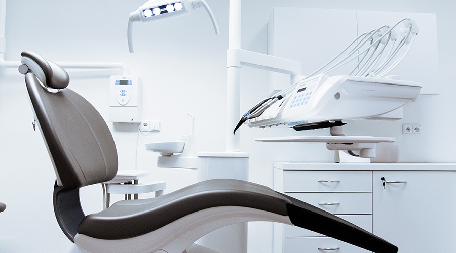 Black and white dental chair in an exam room