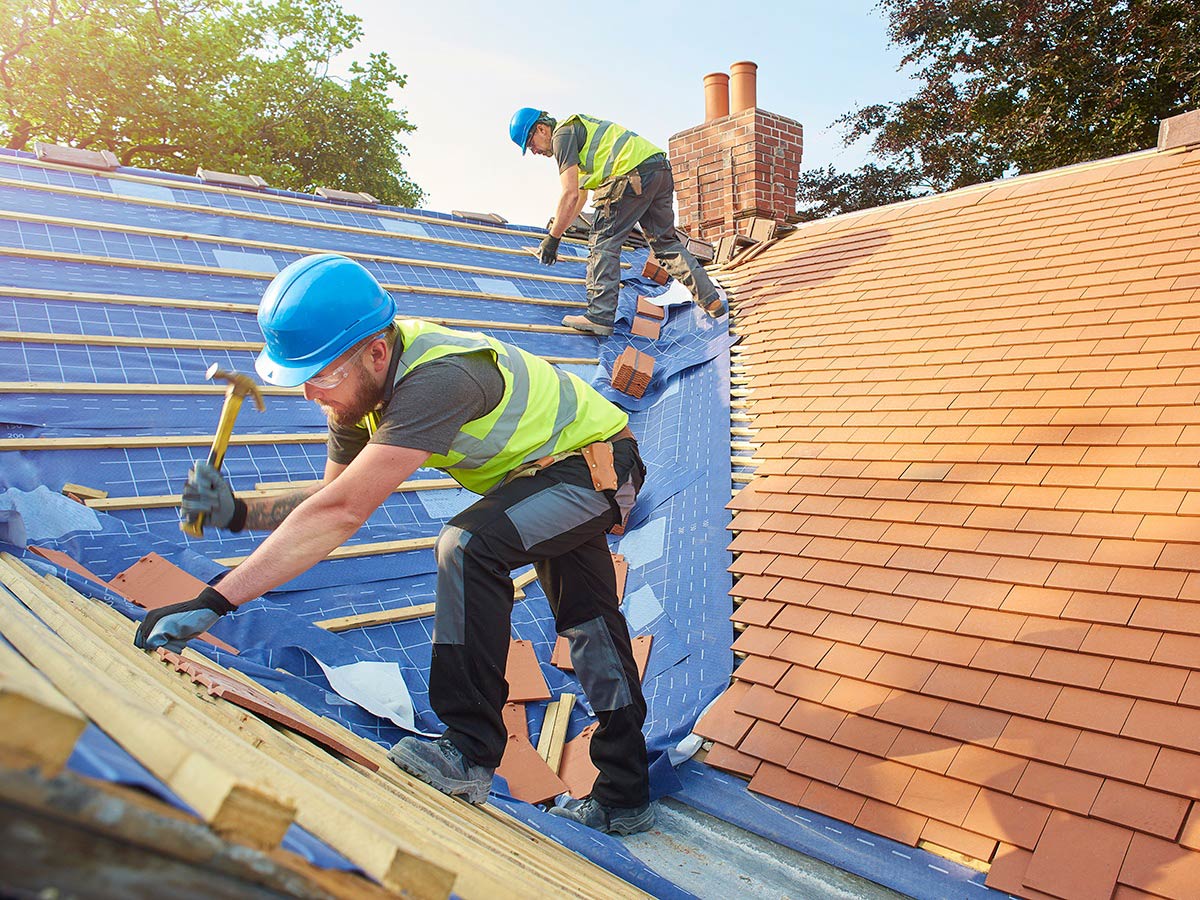 roofer-installing-shingles-on-the-roof